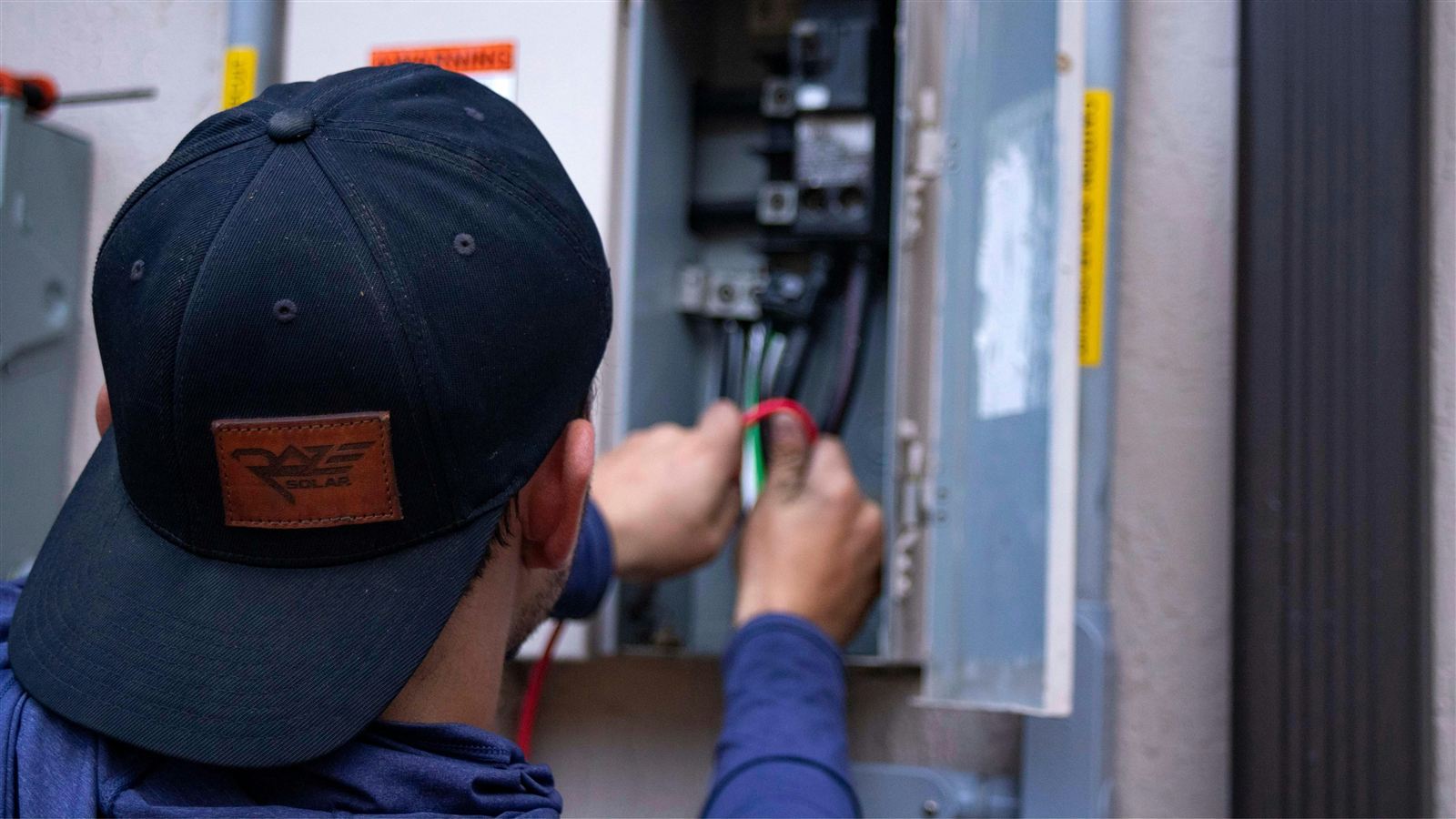 kenner electrician repairing breaker box